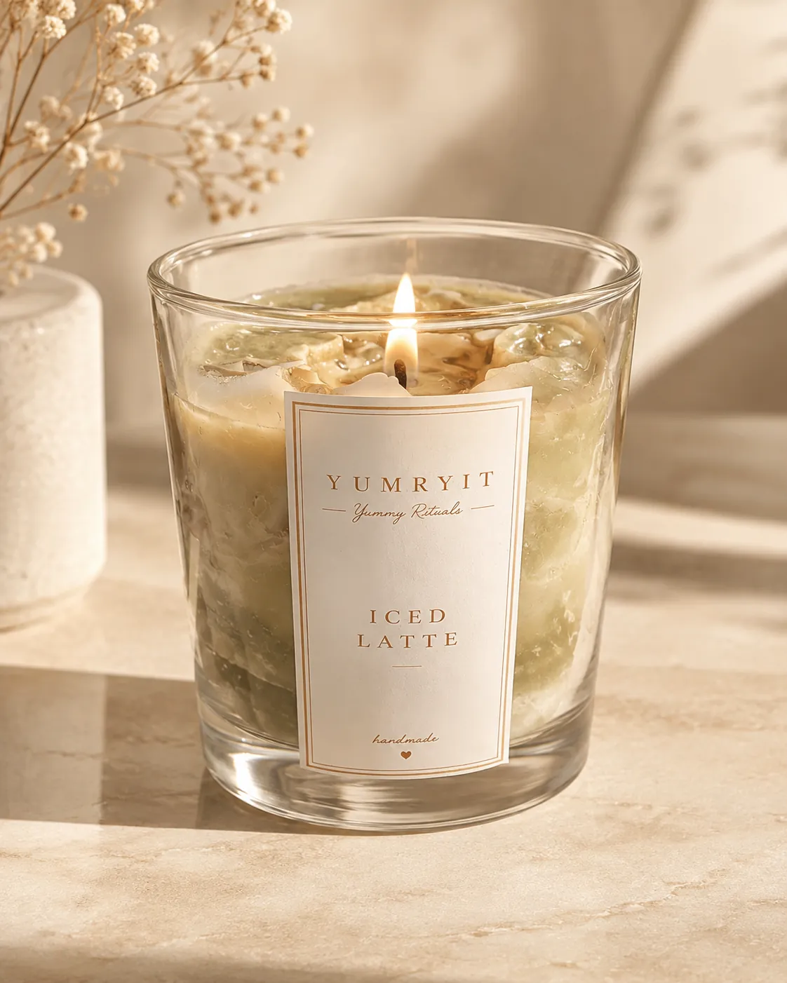 YUMRYIT handmade candle in a warm studio setting